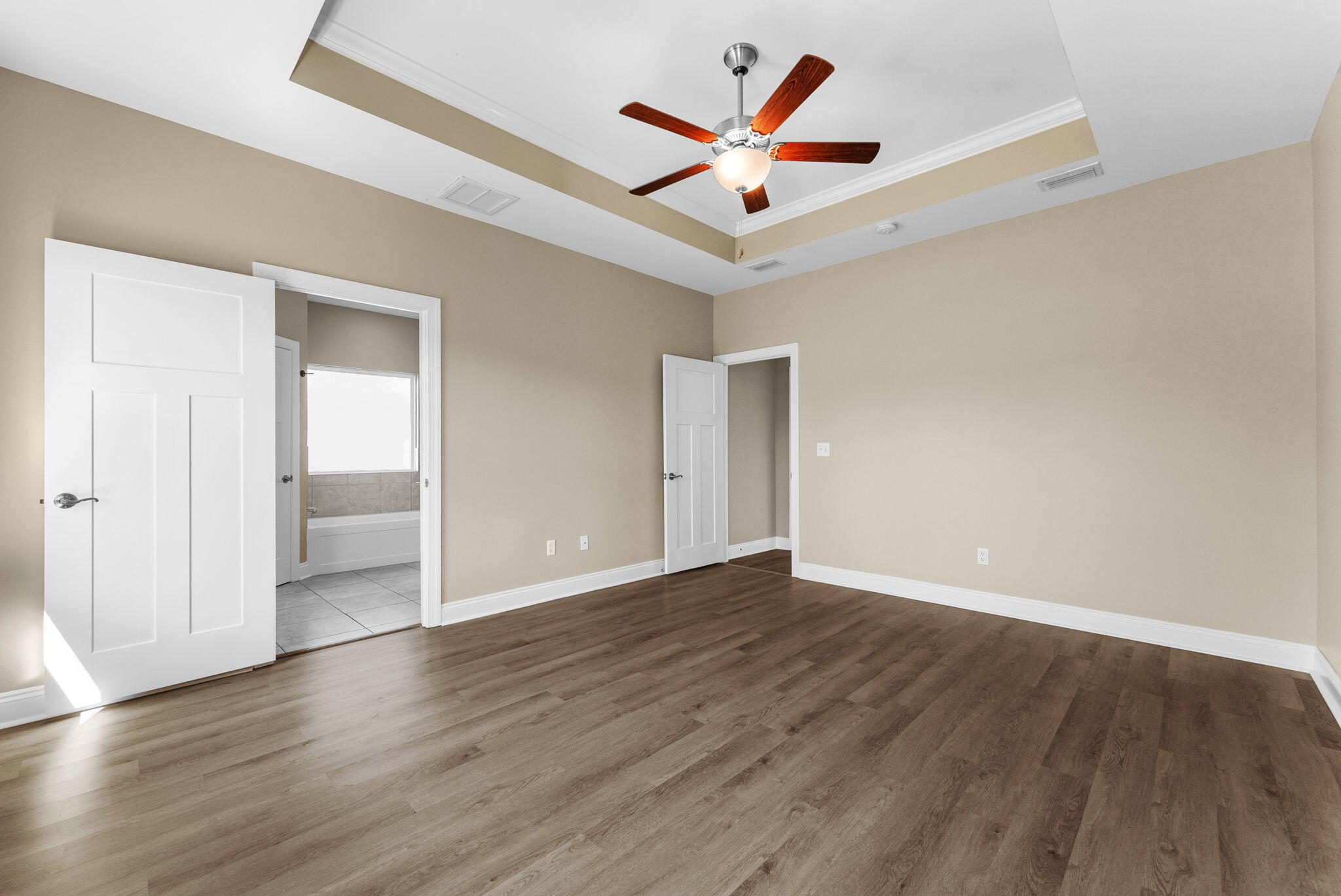 266 Partridge Lane Freeport, FL 32439 - Photo 19 of 36 an empty room with wooden floor and a ceiling fan