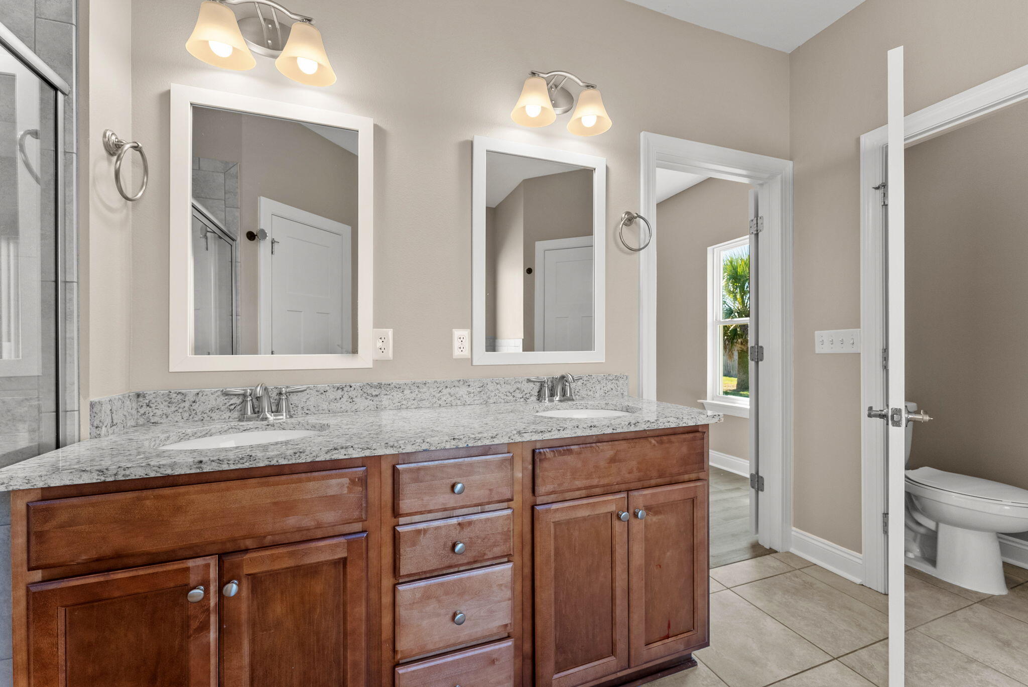 266 Partridge Lane Freeport, FL 32439 - Photo 22 of 36 a bathroom with a granite countertop sink and a mirror