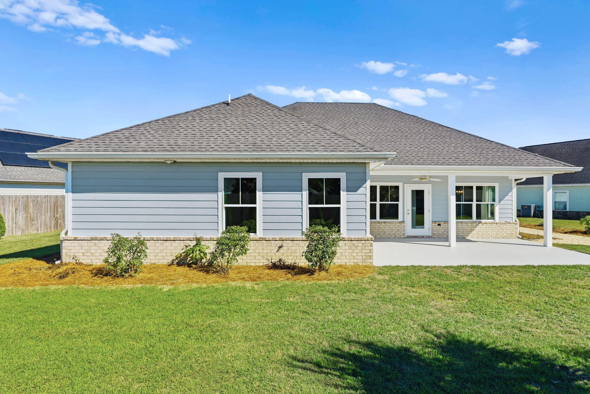 266 Partridge Lane Freeport, FL 32439 - Photo 34 of 36 a front view of house with yard and green space