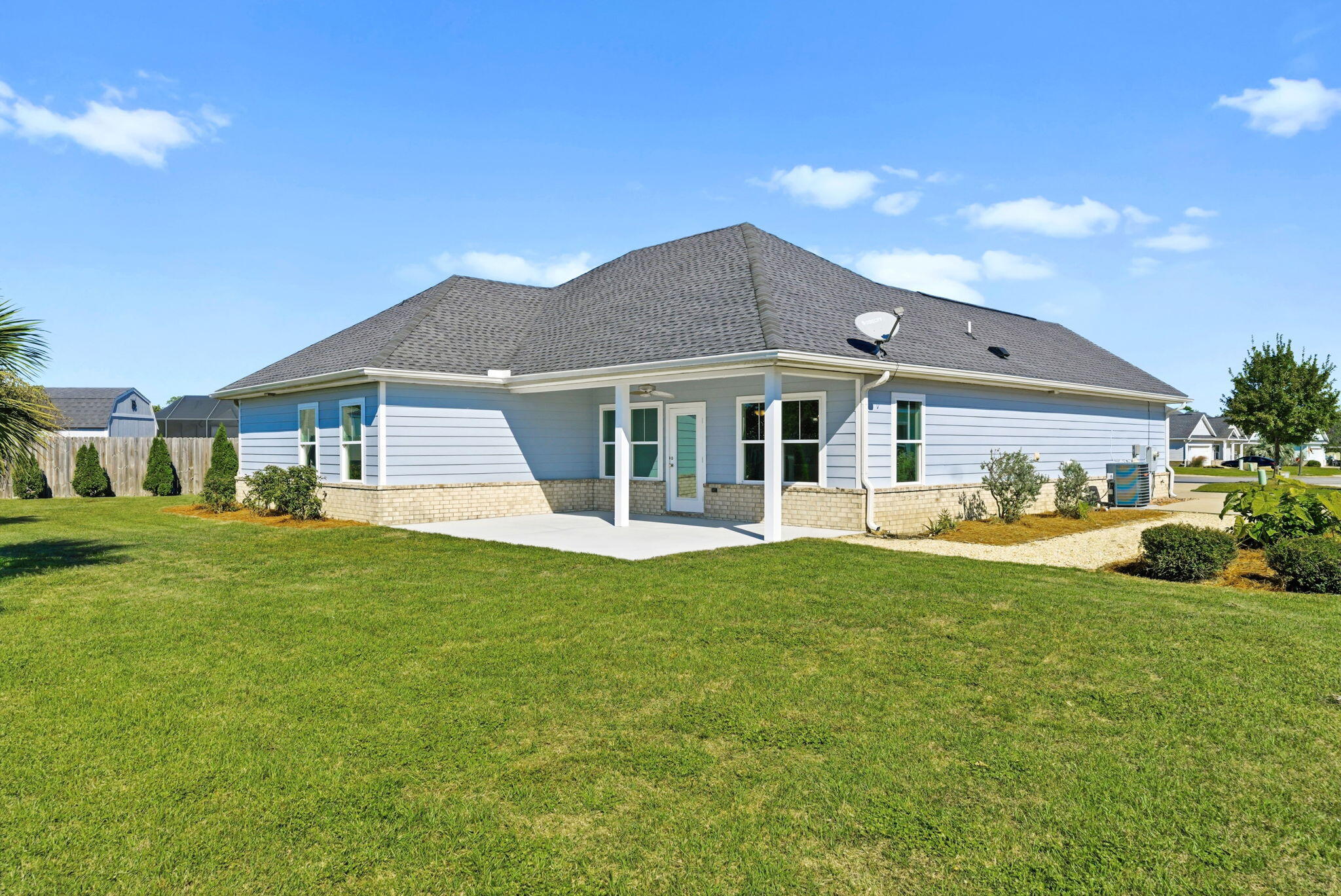 266 Partridge Lane Freeport, FL 32439 - Photo 35 of 36 a front view of a house with a garden