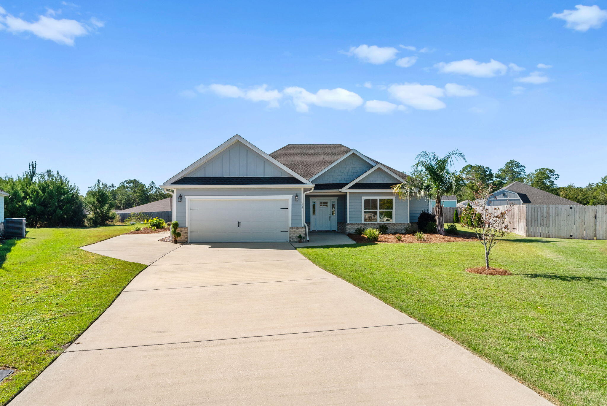 266 Partridge Lane Freeport, FL 32439 - Photo 4 of 36 a front view of house with garden