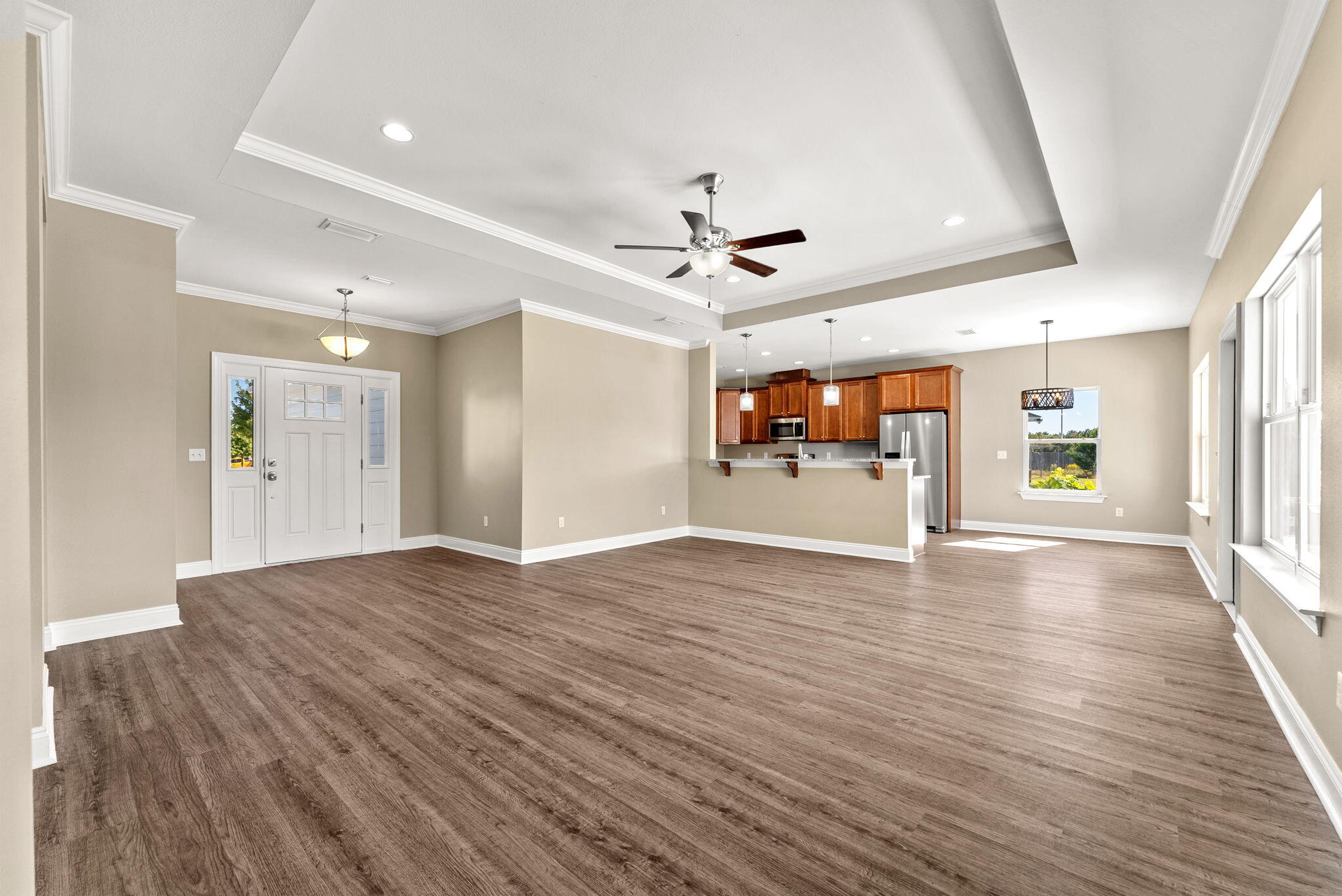 266 Partridge Lane Freeport, FL 32439 - Photo 5 of 36 a view of an empty room with a window and wooden floor