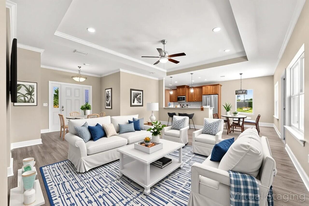 266 Partridge Lane Freeport, FL 32439 - Photo 6 of 36 a living room with furniture ceiling fan and a rug