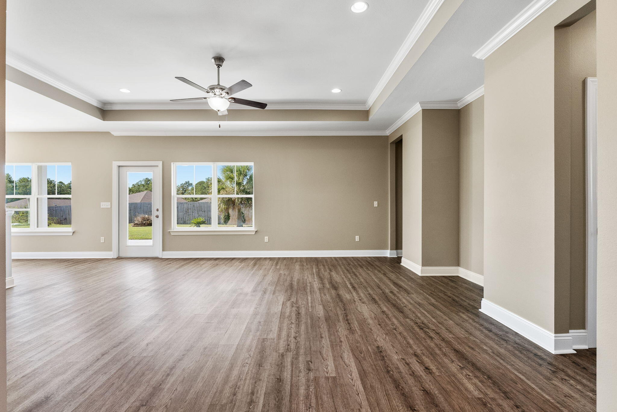 266 Partridge Lane Freeport, FL 32439 - Photo 7 of 36 a view of an empty room with wooden floor and a window