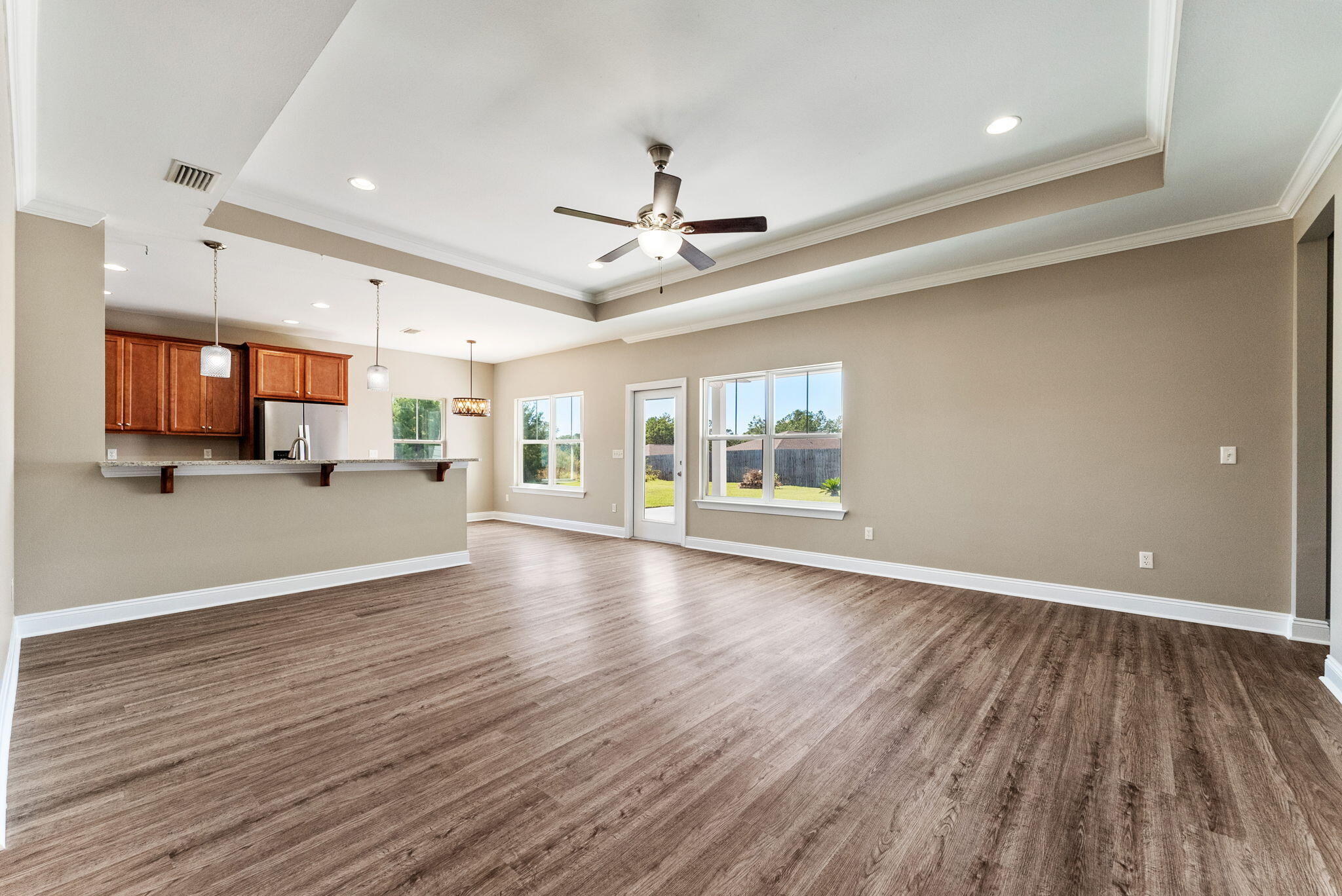 266 Partridge Lane Freeport, FL 32439 - Photo 8 of 36 a view of an empty room with a window and wooden floor