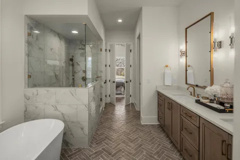 a bathroom with a granite countertop sink a toilet and shower