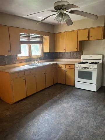 a view of a kitchen with a sink cabinets and a kitchen