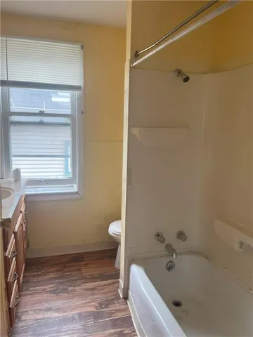 a bathroom with a sink and a window