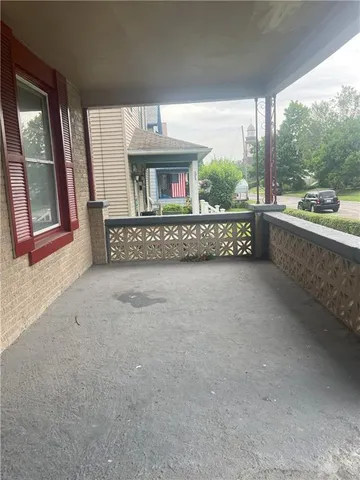 a view of an empty room and a window