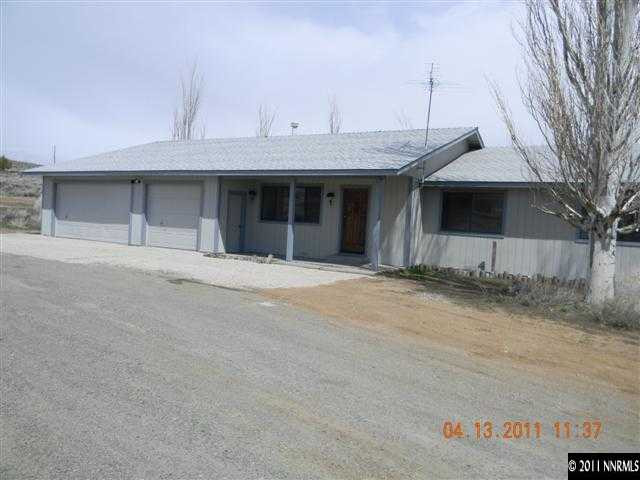 15091 North Red Rock Road Reno, NV 89508 - Photo 1 of 1 a front view of a house with a yard and garage