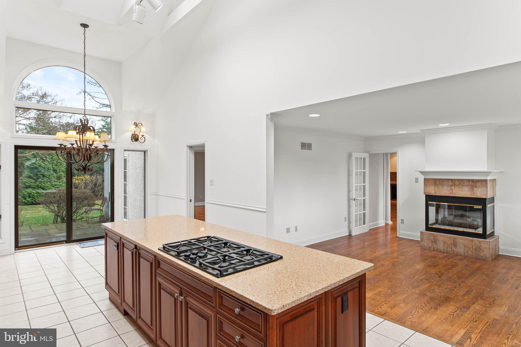 753 Mustin Lane Villanova, PA 19085 - Photo 14 of 40 a kitchen with a stove and a wooden floor