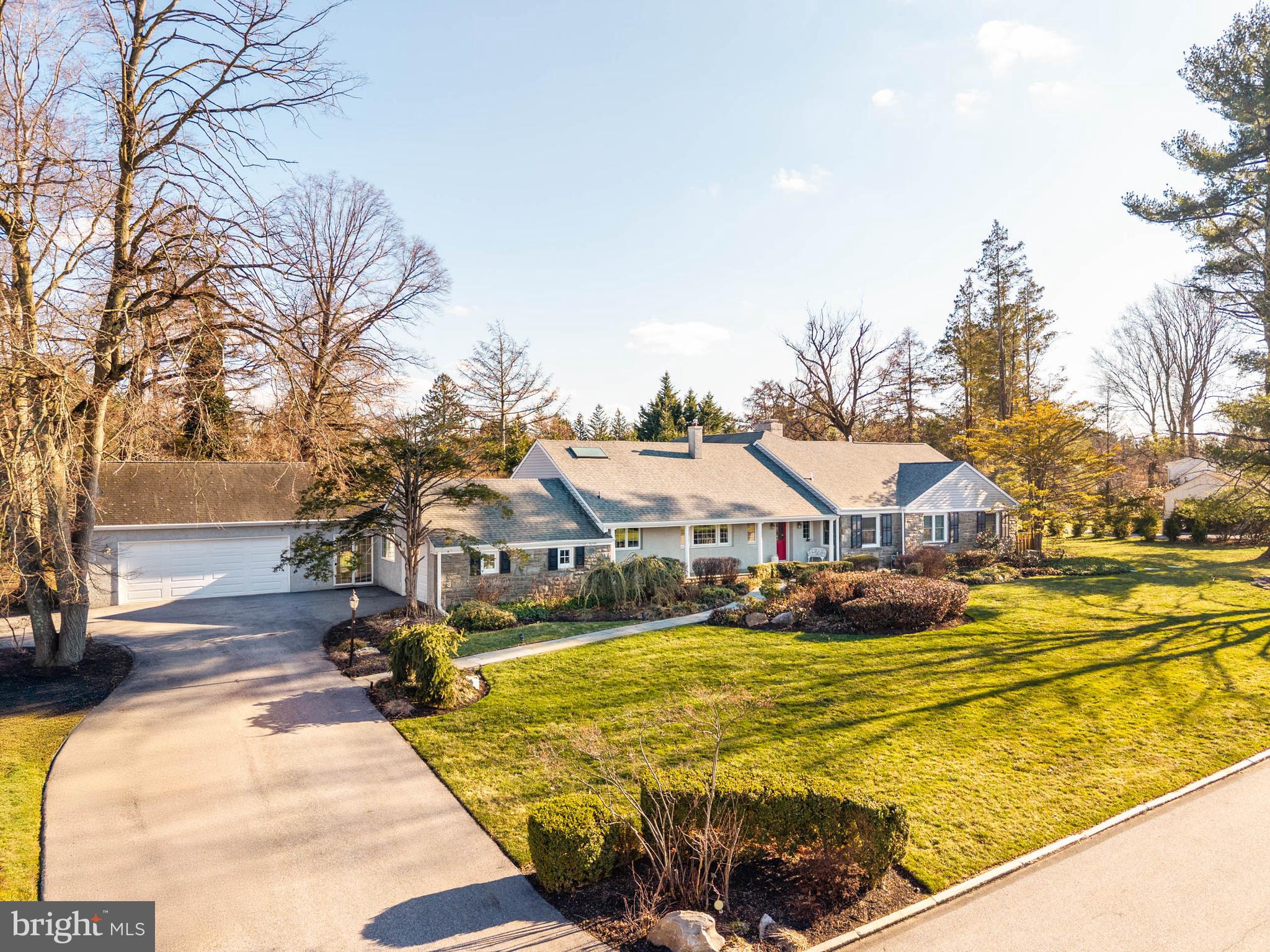 753 Mustin Lane Villanova, PA 19085 - Photo 2 of 40 a view of swimming pool with outdoor seating and trees in the background