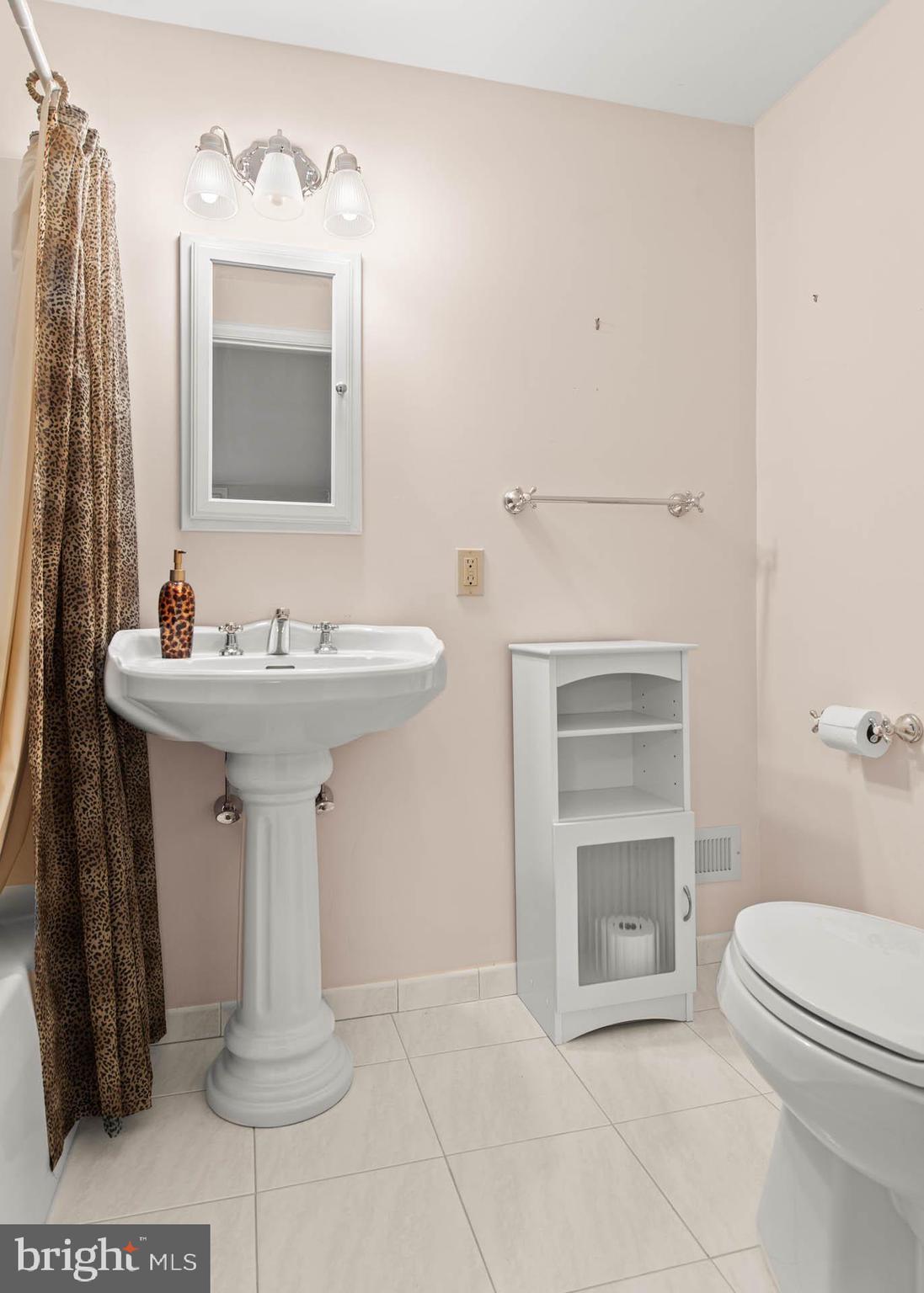 753 Mustin Lane Villanova, PA 19085 - Photo 30 of 40 a bathroom with a sink toilet and shower