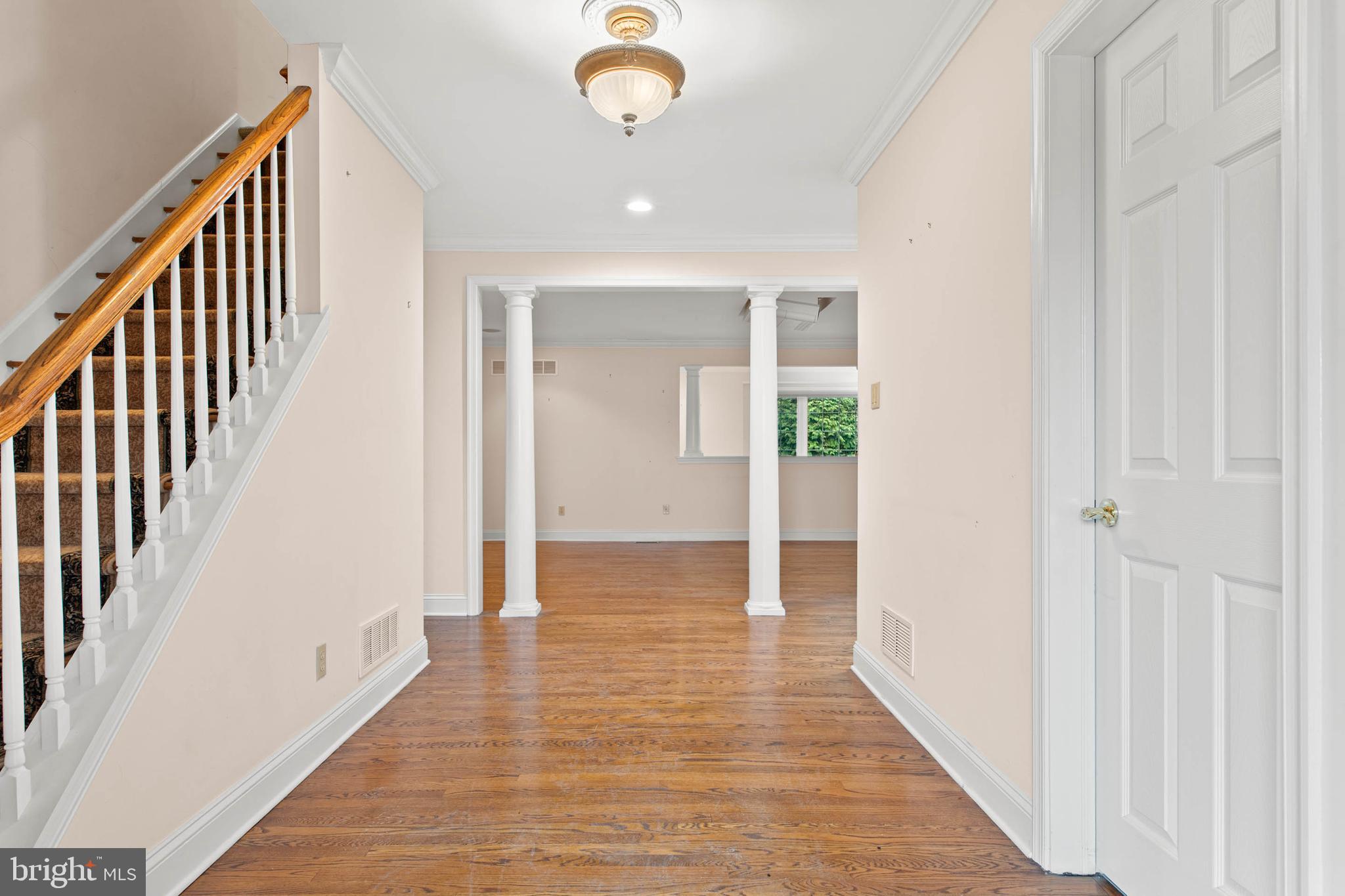 753 Mustin Lane Villanova, PA 19085 - Photo 3 of 40 a view of a hallway with wooden floor and staircase