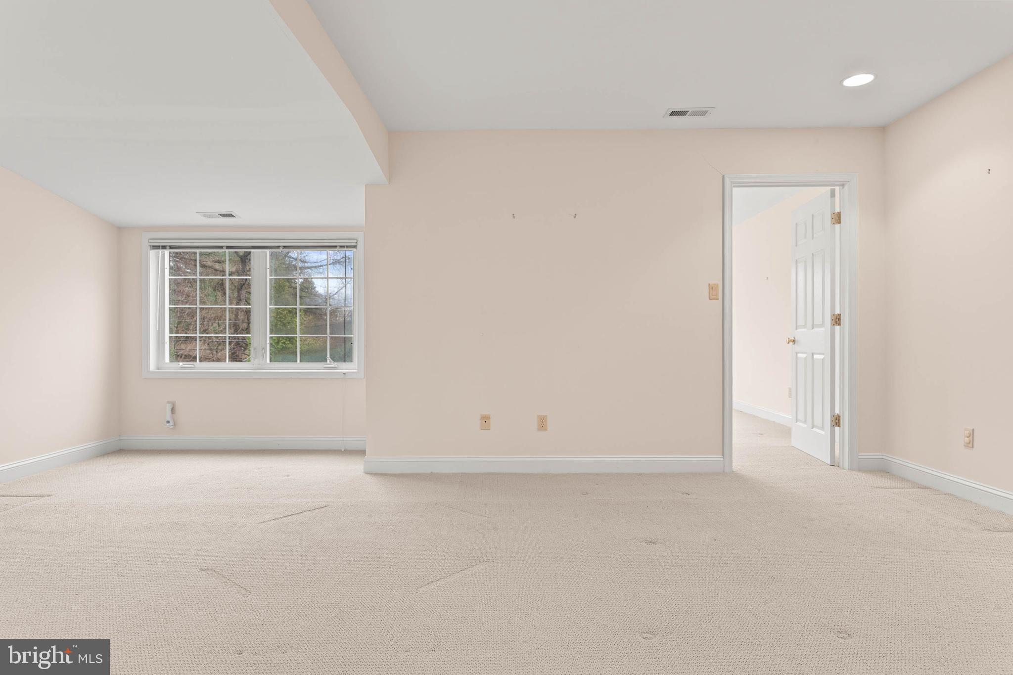753 Mustin Lane Villanova, PA 19085 - Photo 37 of 40 an empty room with wooden floor and windows