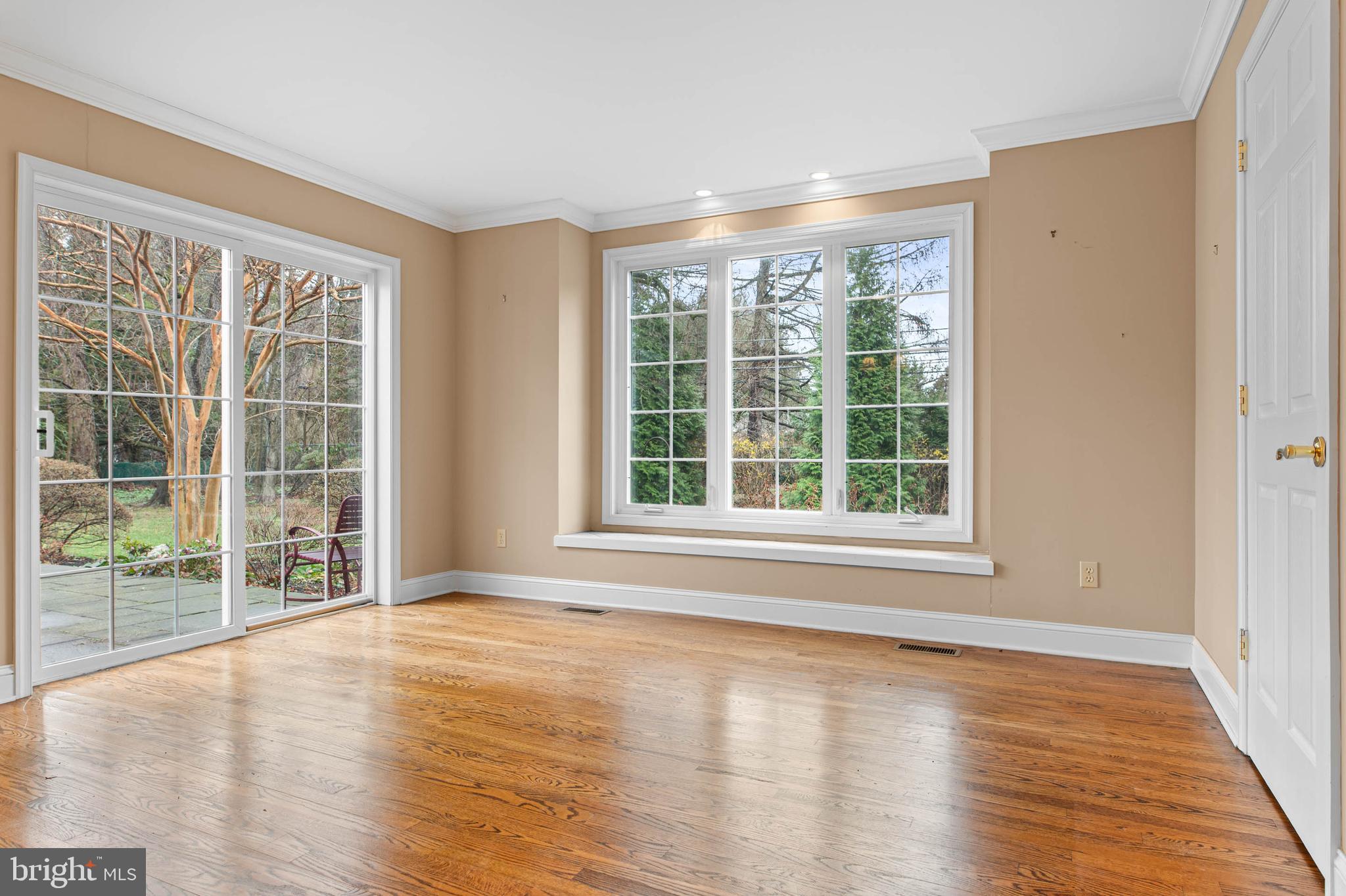 753 Mustin Lane Villanova, PA 19085 - Photo 8 of 40 a view of an empty room with wooden floor and a window
