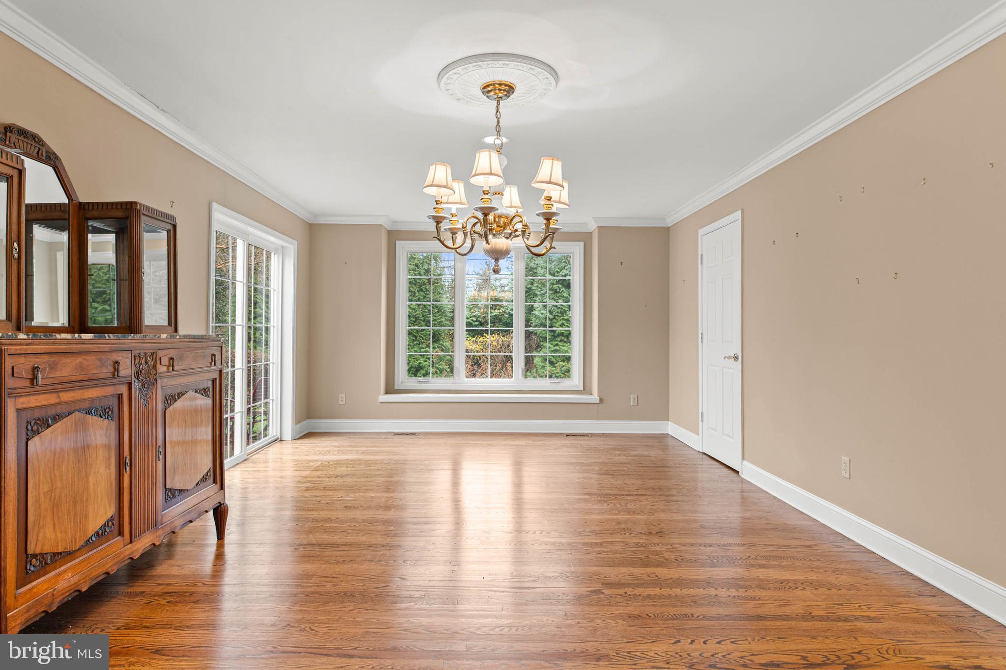 753 Mustin Lane Villanova, PA 19085 - Photo 9 of 40 a view of a livingroom with wooden floor windows and a chandelier