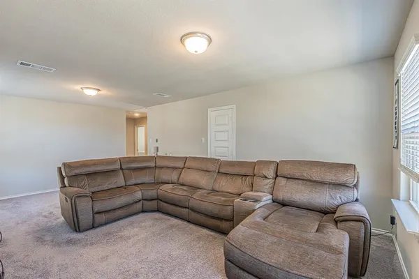 a living room with furniture and a couch