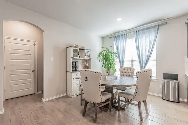 a view of a dining room with furniture and window