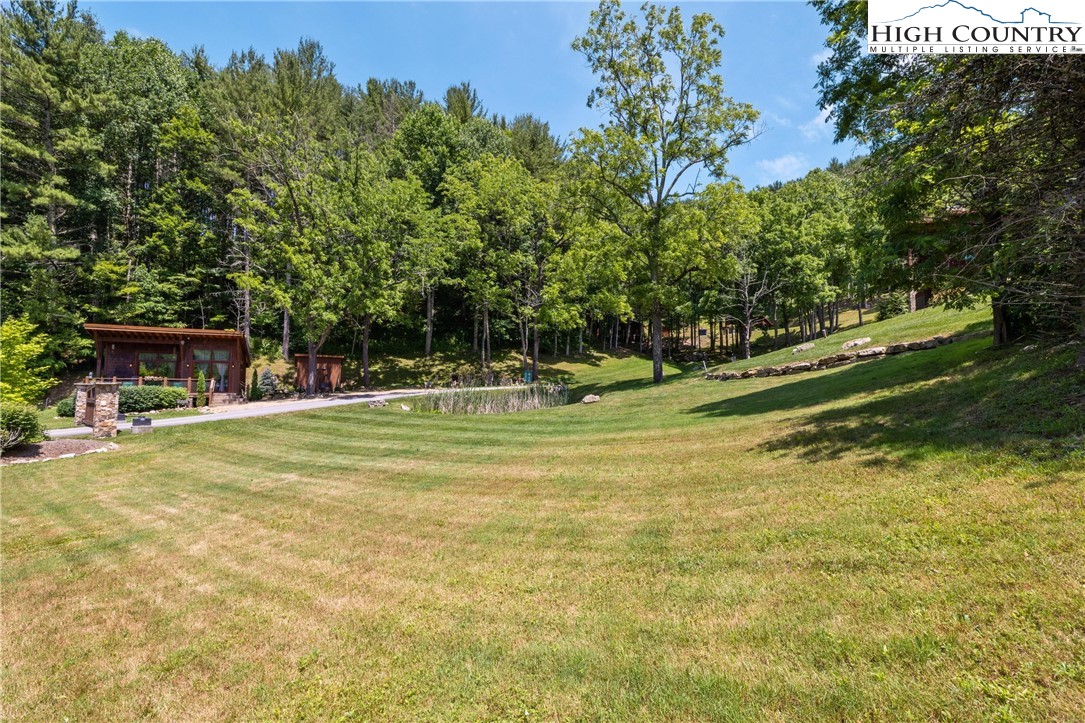 Lot 1 Stonefly Trail Banner Elk, NC 28604 - Photo 7 of 13 a swimming pool with wooden fence