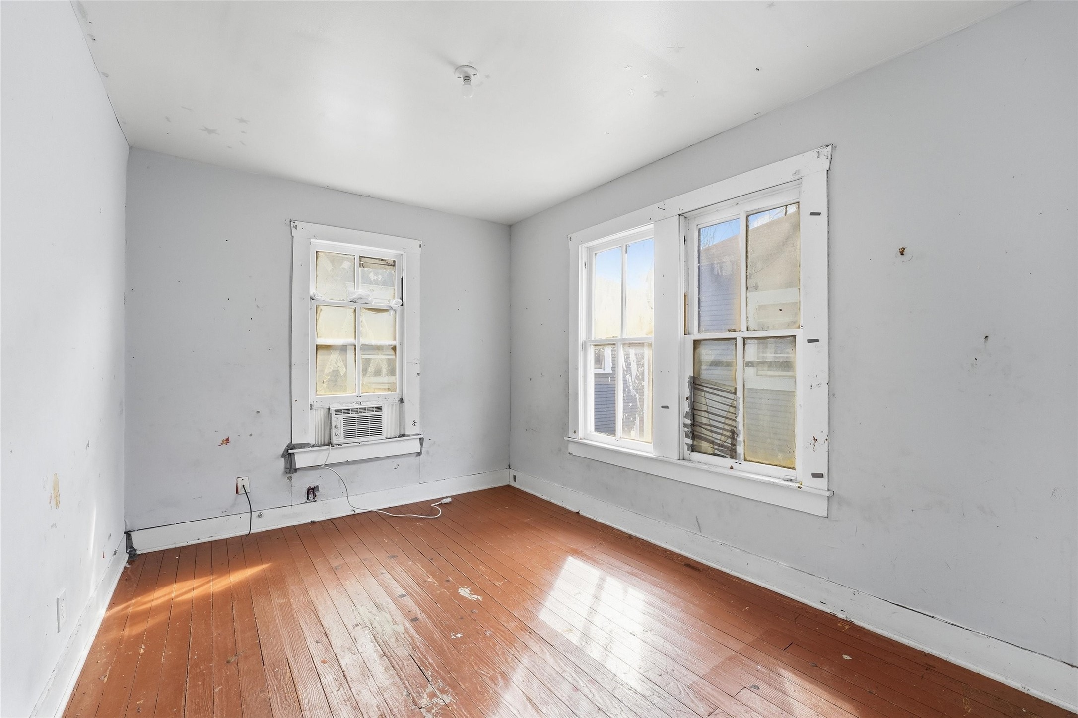 2420 Stevens Street Houston, TX 77026 - Photo 14 of 15 an empty room with wooden floor and windows