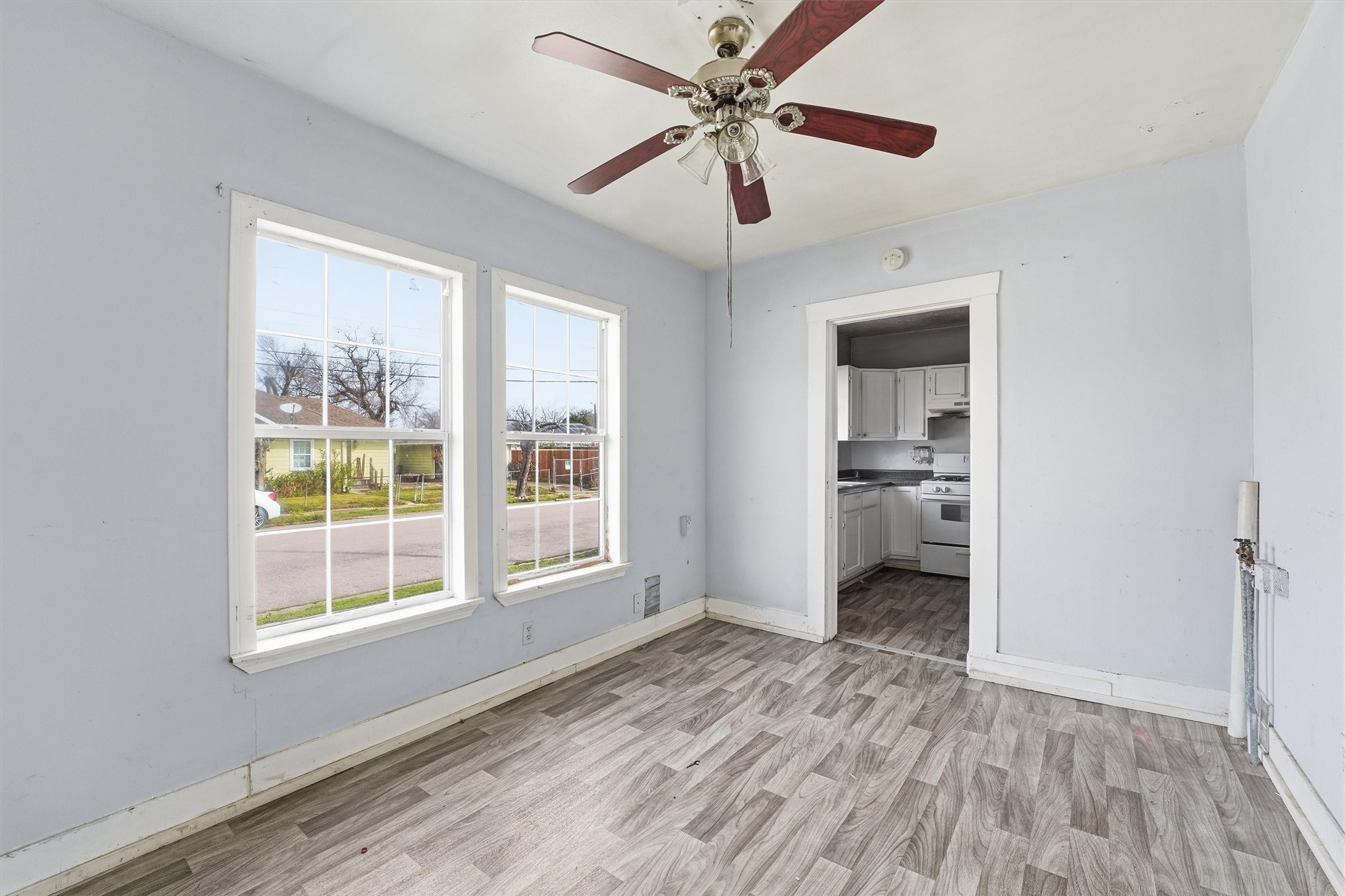 2420 Stevens Street Houston, TX 77026 - Photo 5 of 15 a view of a room with a window and wooden floor