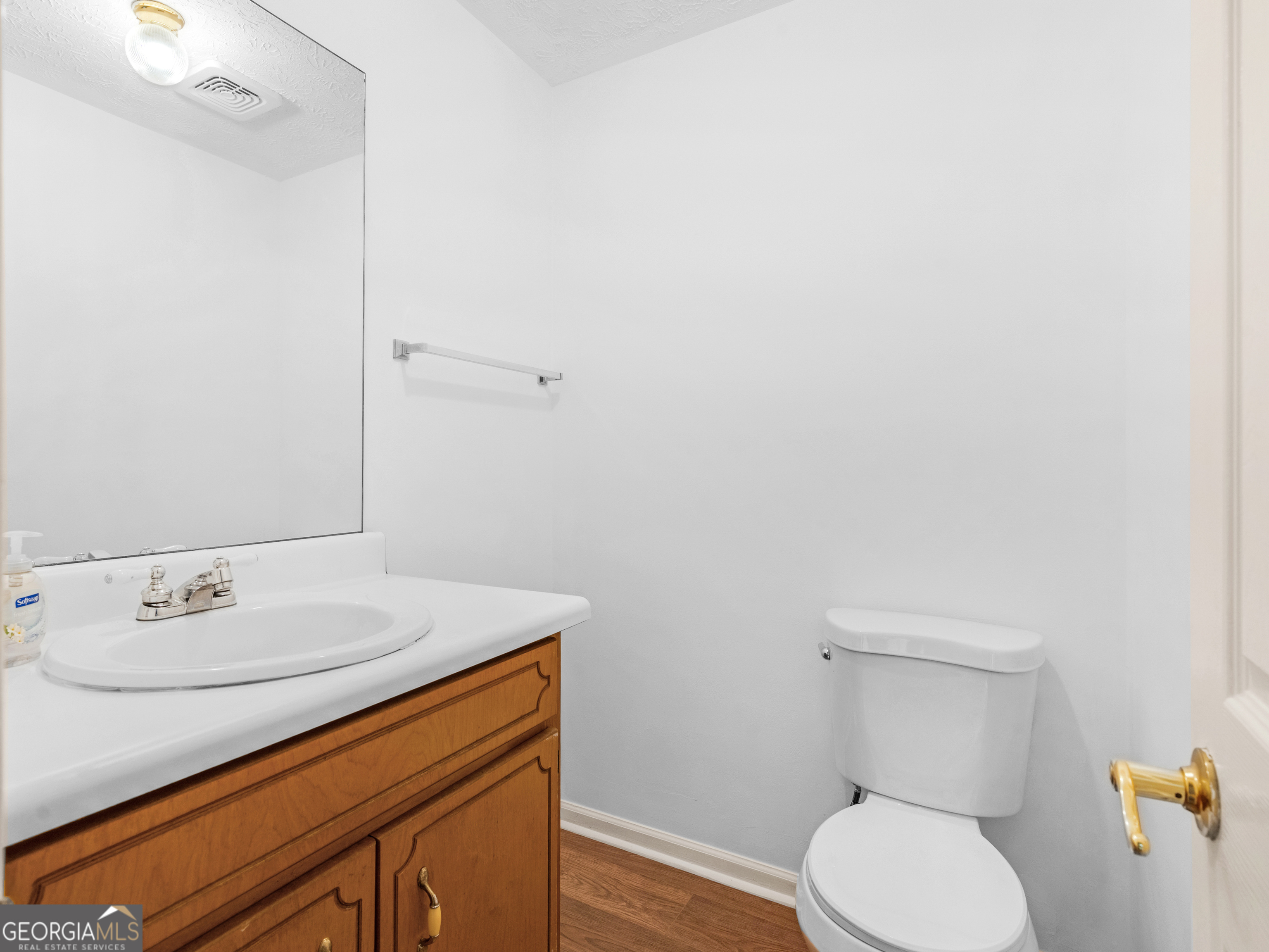 12012 Turner Road Hampton, GA 30228 - Photo 14 of 38 a bathroom with a sink a toilet and a mirror