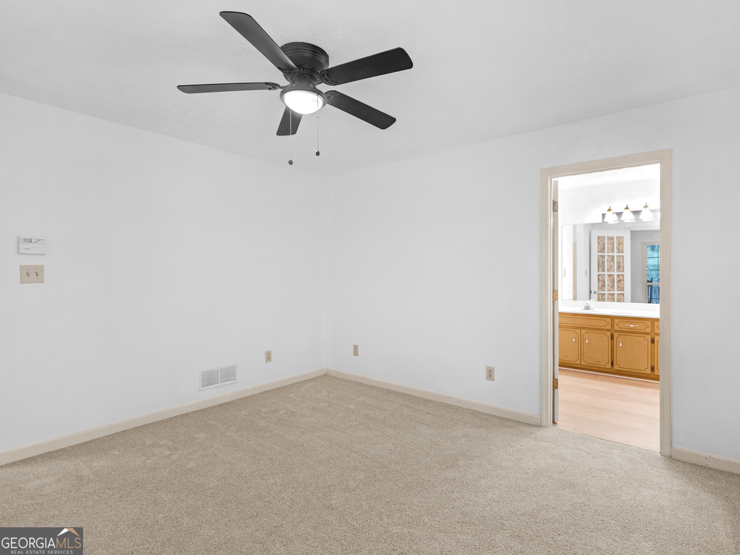 12012 Turner Road Hampton, GA 30228 - Photo 15 of 38 an empty room with a ceiling fan and window