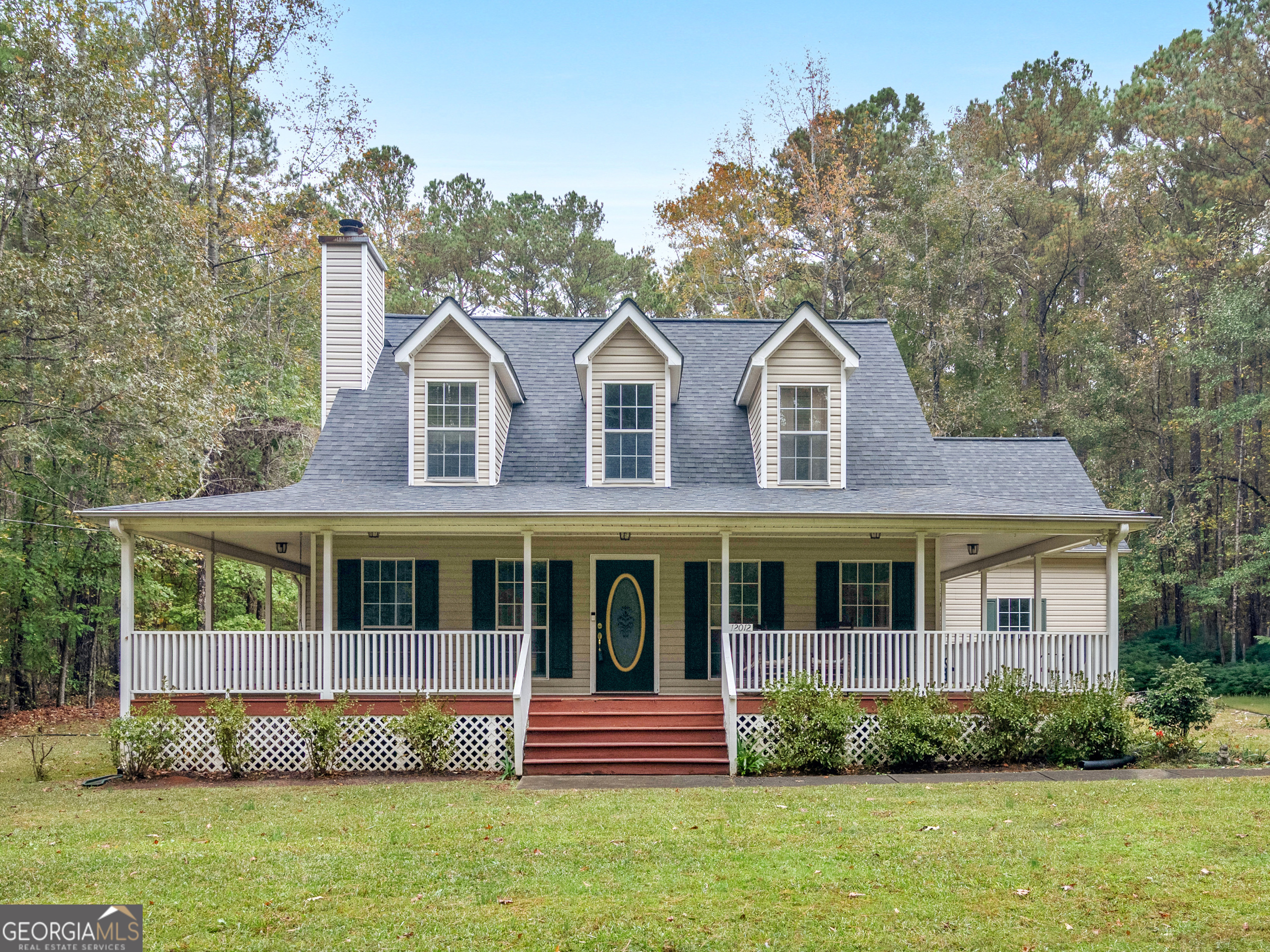 12012 Turner Road Hampton, GA 30228 - Photo 2 of 38 a front view of a house with a garden