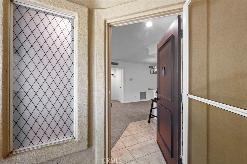 215 South Cross Creek Road, Unit L Orange, CA 92869 - Photo 5 of 50 a view of a bathroom from a corridor