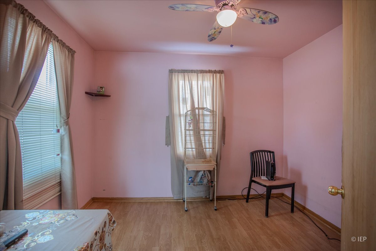1104 Cora Street Joliet, IL 60435 - Photo 12 of 20 a view of a livingroom with furniture and a window
