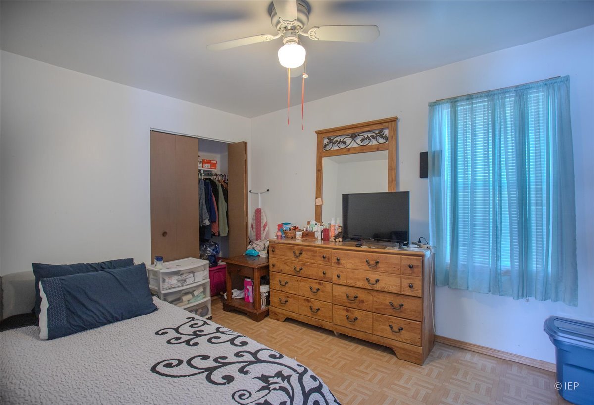 1104 Cora Street Joliet, IL 60435 - Photo 13 of 20 a living room with furniture and a flat screen tv