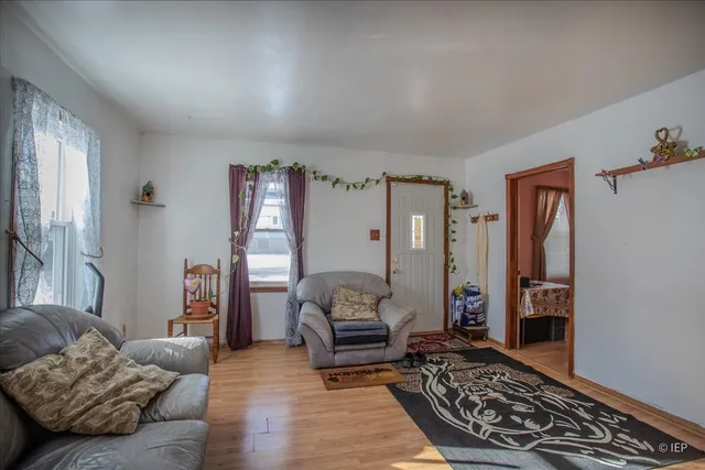a living room with furniture and a rug