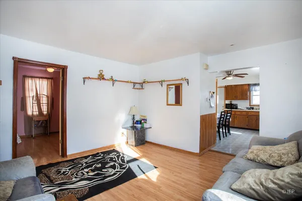 a living room with furniture rug and window