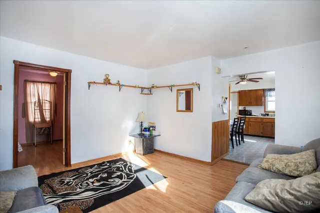 a living room with furniture rug and window