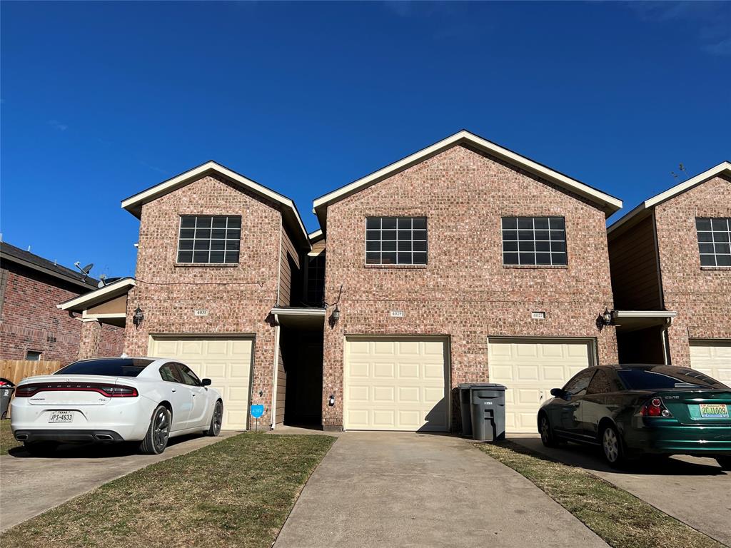 a front view of a house with parking space