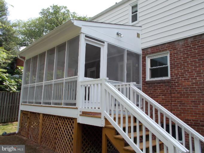 9504 Monroe Street Silver Spring, MD 20910 - Photo 1 of 26 a view of wooden house with large windows