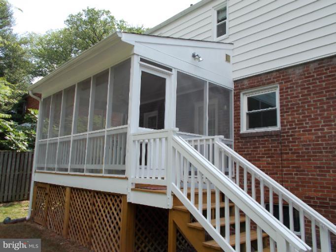 9504 Monroe Street Silver Spring, MD 20910 - Photo 14 of 26 a view of wooden house with large windows