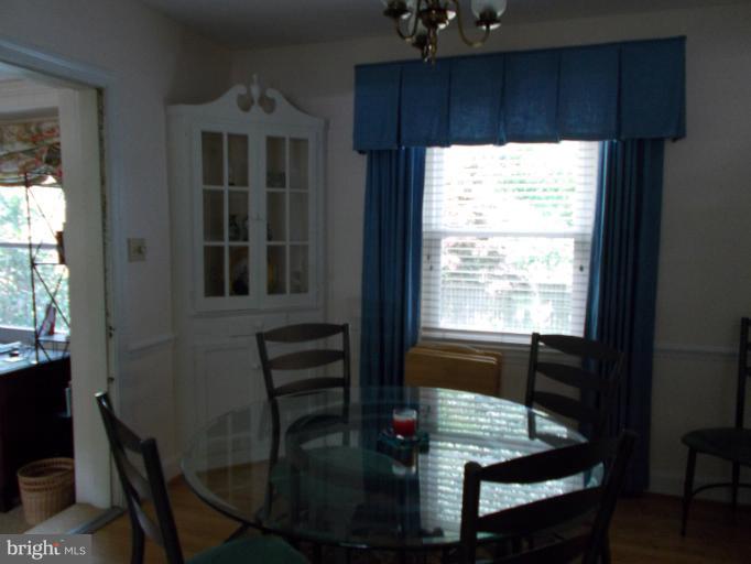 9504 Monroe Street Silver Spring, MD 20910 - Photo 20 of 26 a view of a dining room with furniture and wooden floor