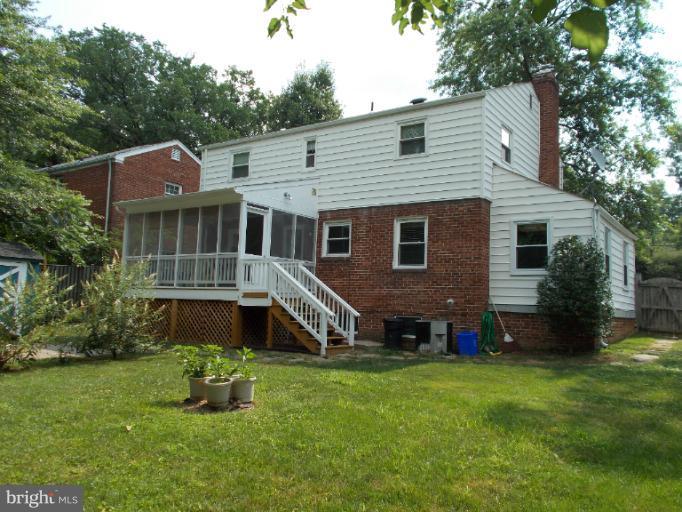 9504 Monroe Street Silver Spring, MD 20910 - Photo 22 of 26 a aerial view of a house next to a big yard and large trees