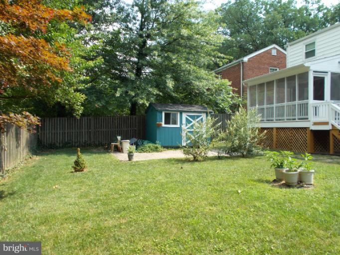 9504 Monroe Street Silver Spring, MD 20910 - Photo 4 of 26 a backyard of a house with table and chairs