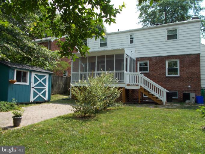 9504 Monroe Street Silver Spring, MD 20910 - Photo 6 of 26 a front view of a house with a yard and potted plants