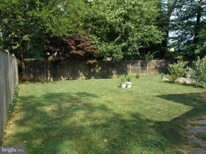 9504 Monroe Street Silver Spring, MD 20910 - Photo 9 of 26 a backyard of a house with lots of green space and fountain