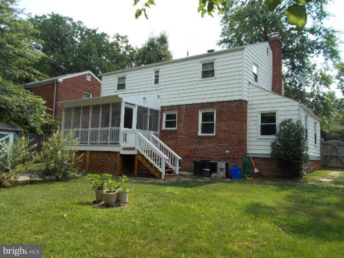 9504 Monroe Street Silver Spring, MD 20910 - Photo 10 of 26 a aerial view of a house with a yard table and chairs