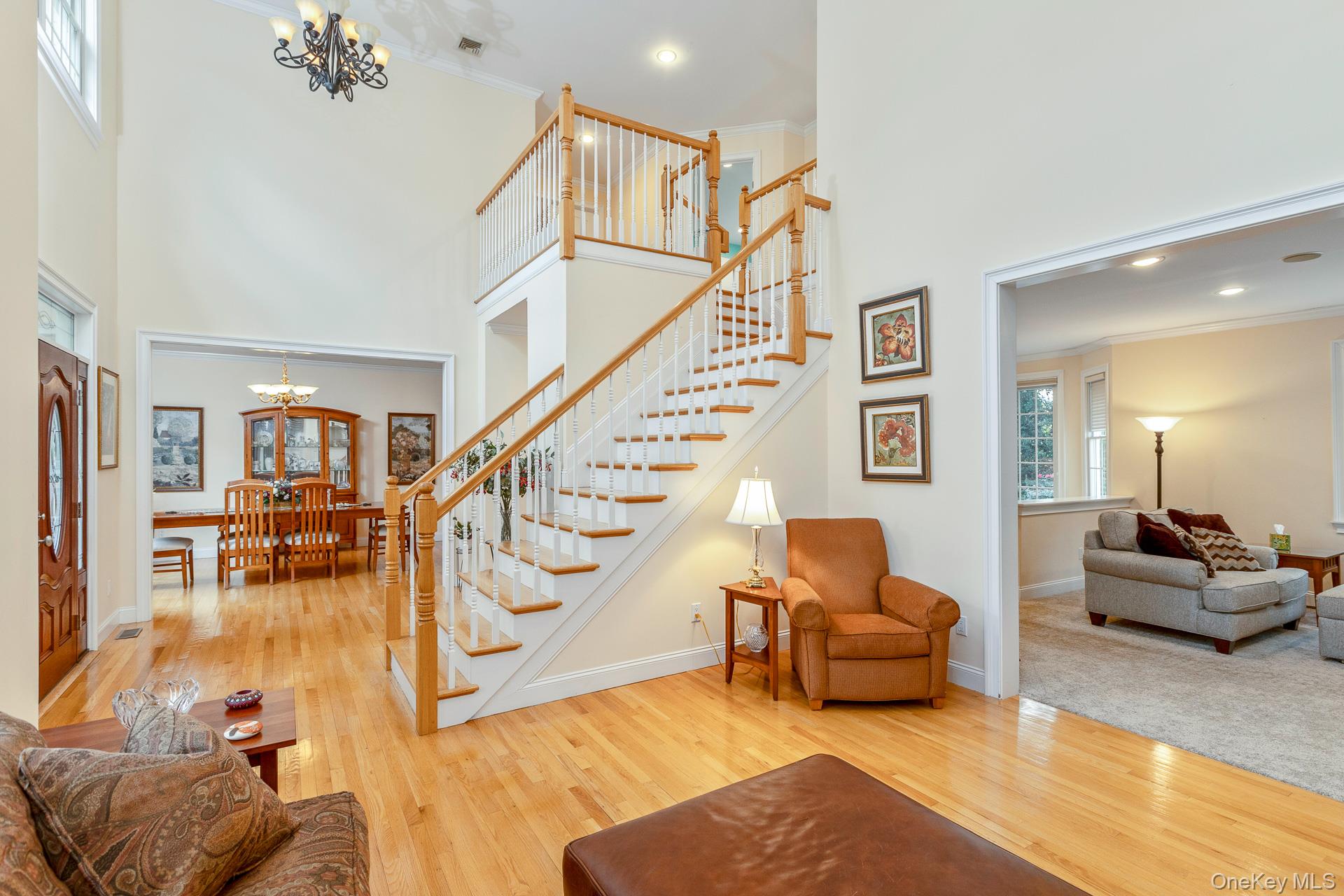 4 Martin Avenue Shoreham, NY 11786 - Photo 11 of 50 a living room with furniture and a chandelier