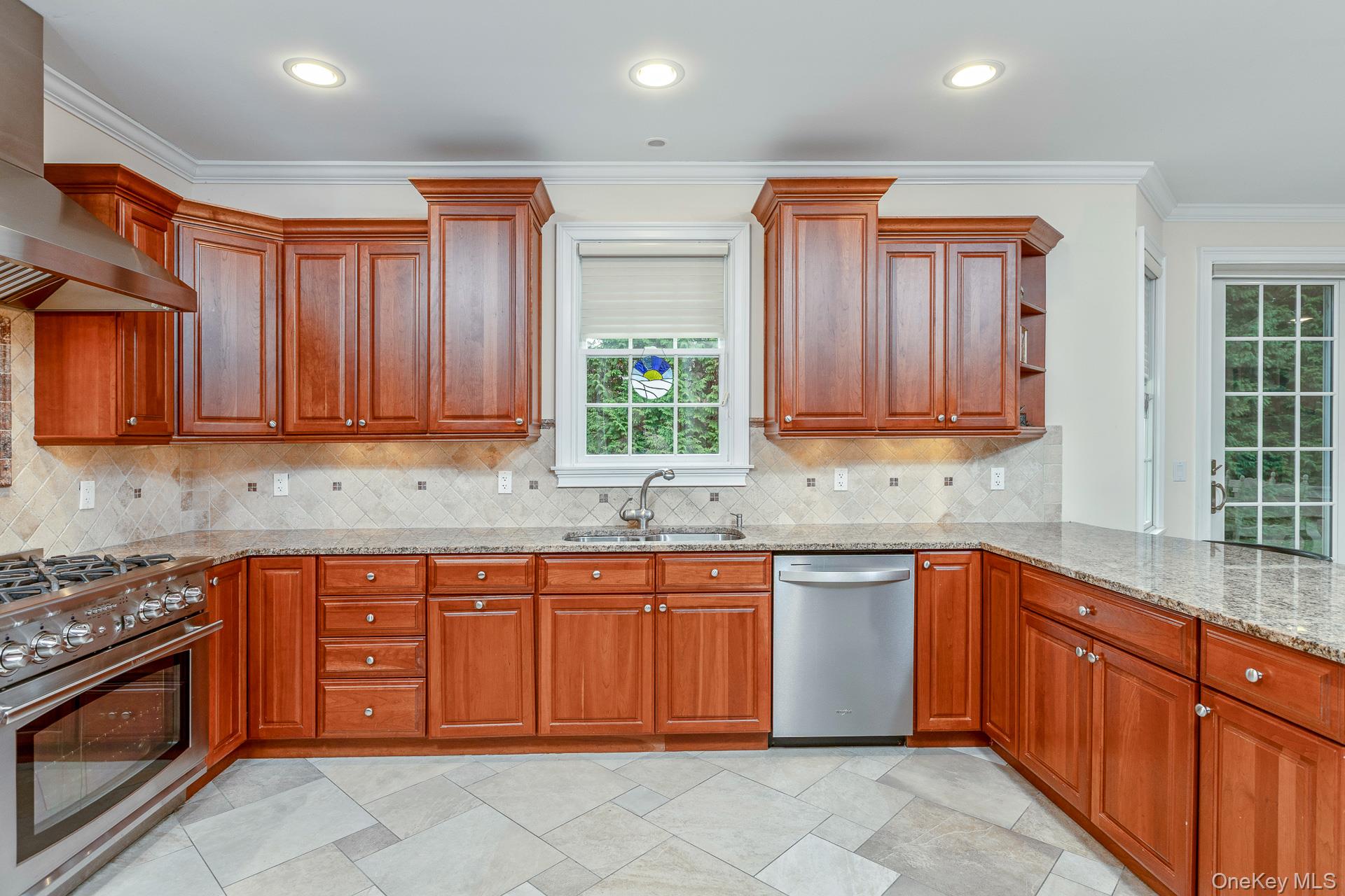 4 Martin Avenue Shoreham, NY 11786 - Photo 16 of 50 a kitchen with stainless steel appliances granite countertop wooden cabinets a sink and dishwasher