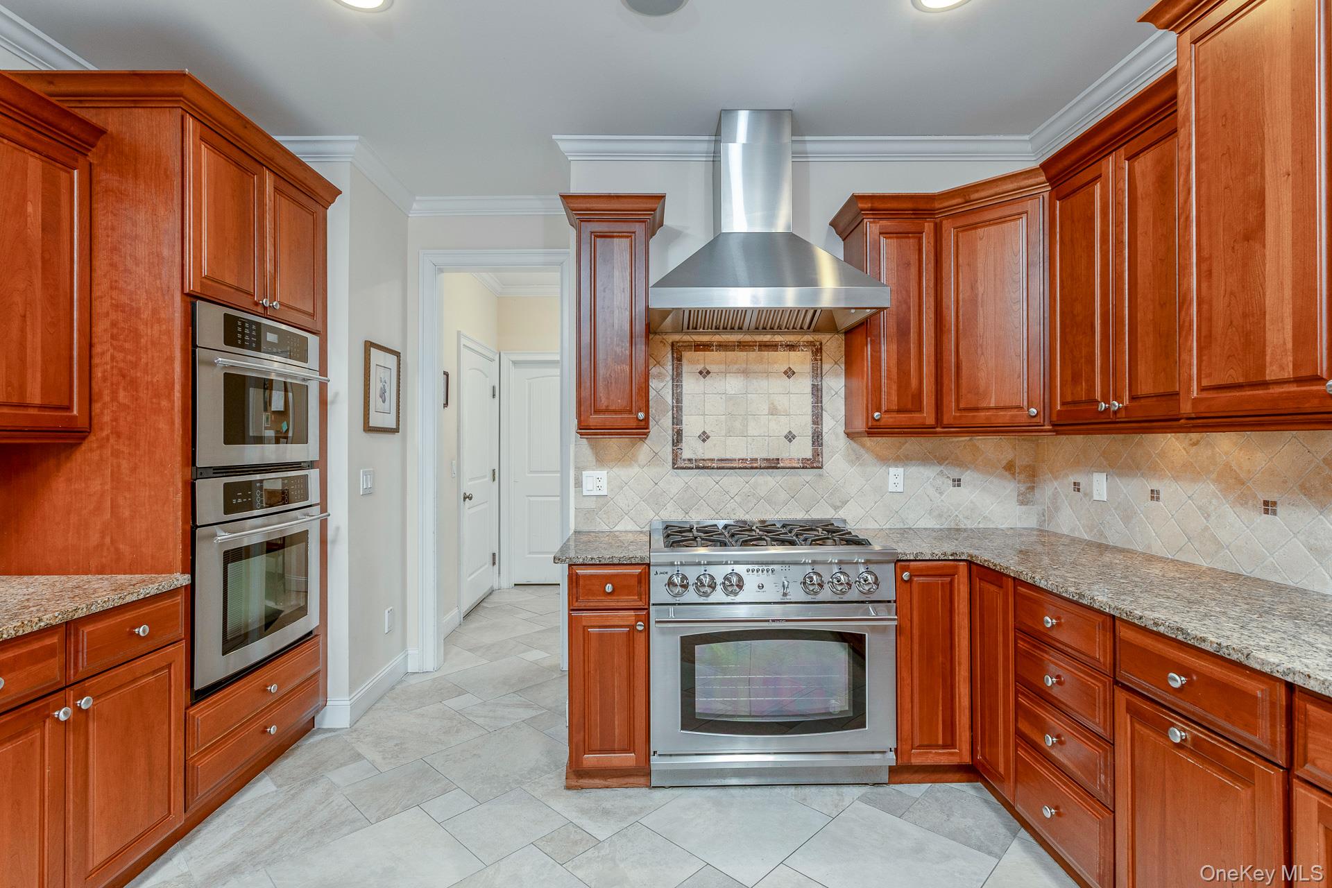 4 Martin Avenue Shoreham, NY 11786 - Photo 17 of 50 a kitchen with stainless steel appliances granite countertop a stove and cabinets