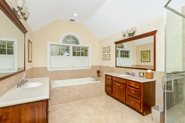 a bathroom with a shower and a sink