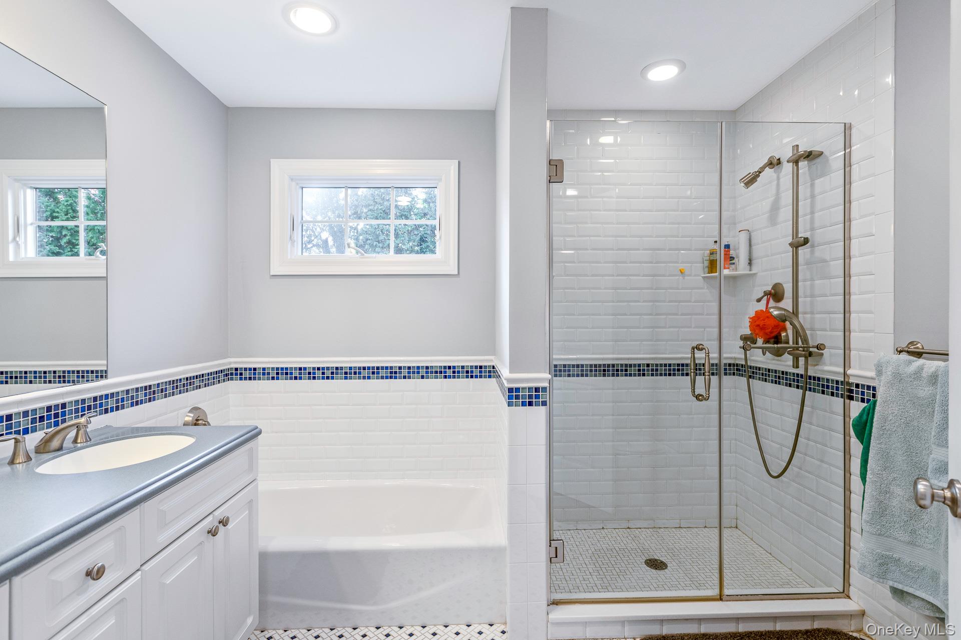 4 Martin Avenue Shoreham, NY 11786 - Photo 26 of 50 a bathroom with a shower sink and mirror