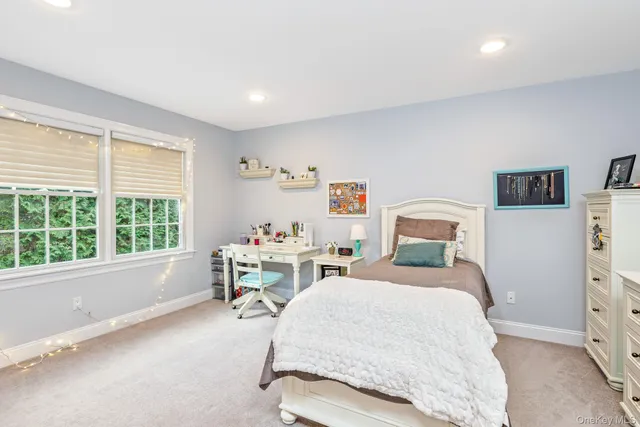 a view of empty room with fireplace and fan